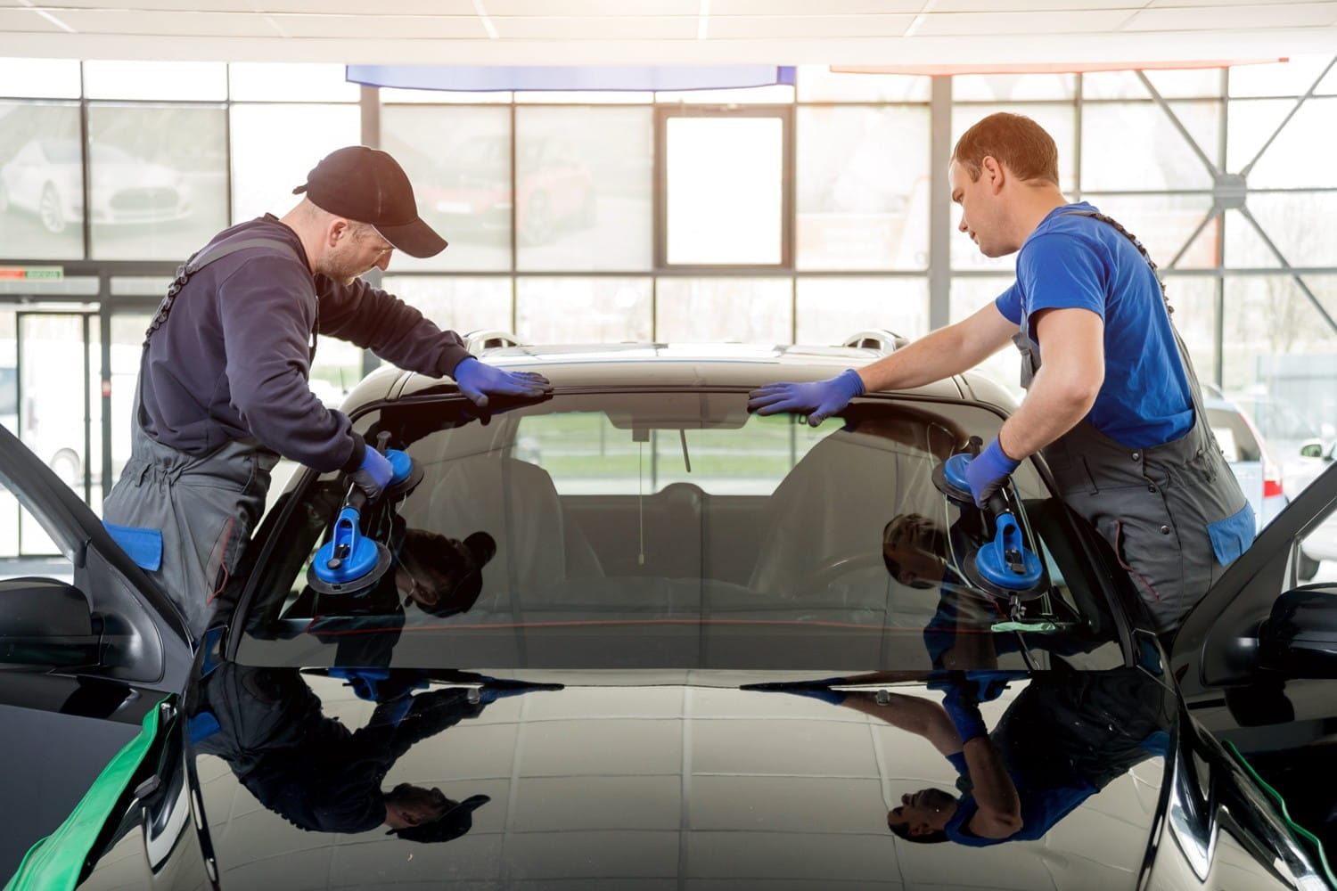 Auto Glass Technicians Replacing Windshield